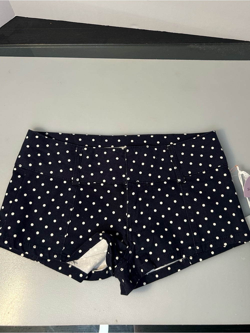 Women’s size XS navy blue and white polka dot shorts ( brand new)